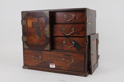 Lot 68 - A Japanese inlaid table cabinet, the cupboard...