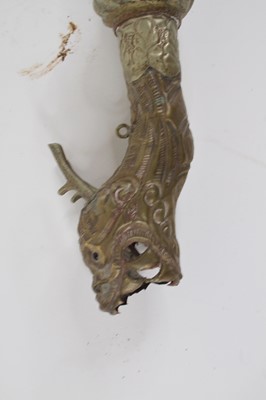 Lot 70 - A Tibetan brass dragon horn, 38cm