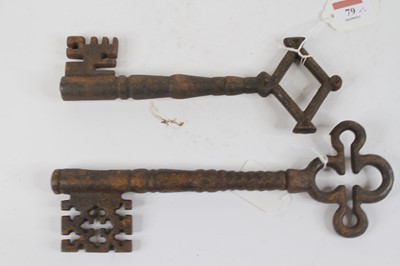 Lot 79 - Two large cast iron keys, the largest length 28cm