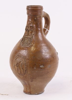 Lot 34 - An 18th century German stoneware Bartmann jug,...