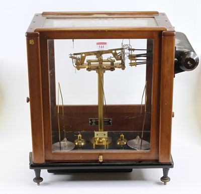 Lot 144 - An early 20th century brass set of scales,...