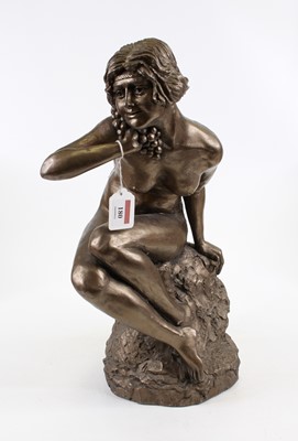 Lot 180 - A bronzed figure of a lady, shown seated upon...