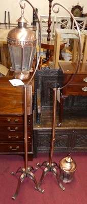Lot 1174 - A pair of brushed copper freestanding lanterns,...