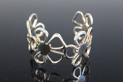 Lot 403 - A Tiffany style cuff bangle, with box and bag;...
