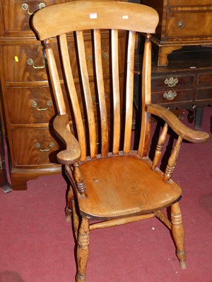 Lot 1335 - An early 20th century elm and beech slatback...