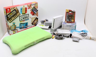 Lot 1768 - A Ninitendo Wii console together with a motion...
