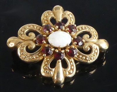 Lot 2555 - A 9ct yellow gold, opal and garnet Celtic...