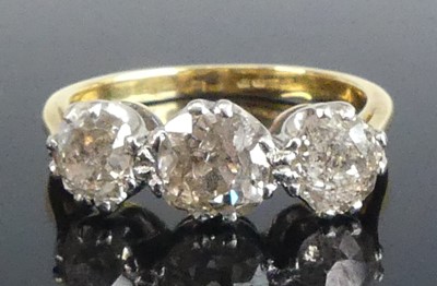 Lot 2558 - A yellow and white metal diamond three-stone...