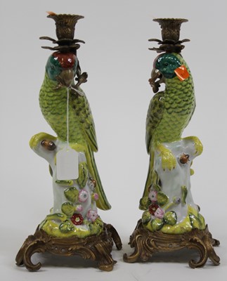 Lot 11 - A pair of porcelain table candlesticks, each...