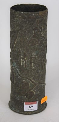 Lot 69 - A trench art shell case vase, with repousse...