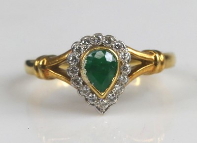 Lot 2181 - An 18ct yellow and white gold, emerald and...