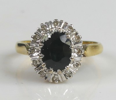 Lot 2573 - An 18ct yellow and white gold, sapphire and...