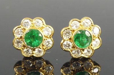 Lot 2577 - A pair of 18ct yellow gold emerald and diamond...
