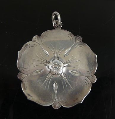 Lot 2596 - A continental silver flower head pendant,...