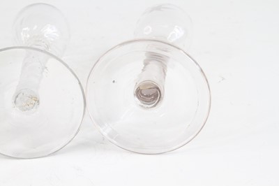 Lot 2051 - A pair of wine glasses, circa 1770, the basal...