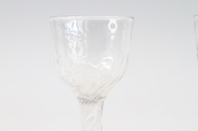 Lot 2051 - A pair of wine glasses, circa 1770, the basal...