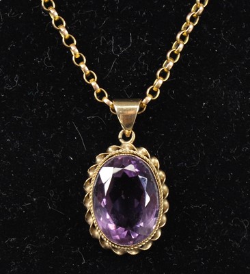 Lot 2706 - A 9ct yellow gold amethyst pendant, featuring...