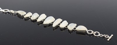 Lot 2665 - A contemporary silver and moonstone bracelet,...