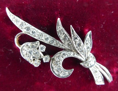 Lot 2760 - A white metal diamond brooch in the form of a...