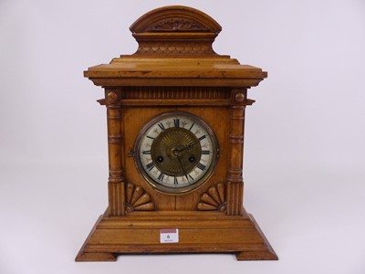 Lot 6 - A late Victorian oak cased mantel clock, the...