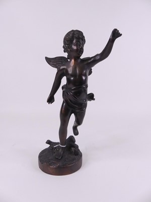 Lot 7 - A bronzed figure of a cherub, modelled...