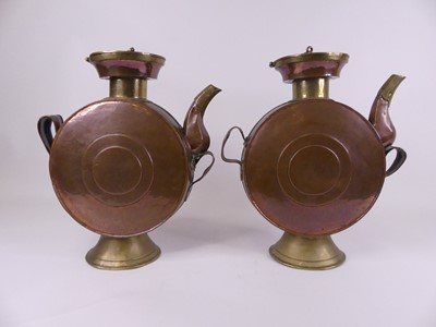 Lot 10 - A pair of Eastern copper drum-shaped canisters,...
