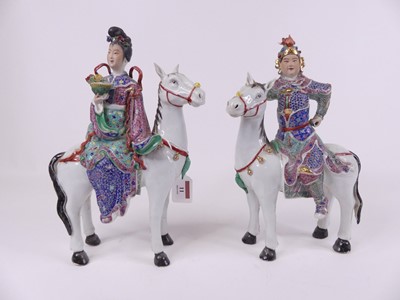 Lot 11 - A pair of Chinese porcelain figures of a lady...