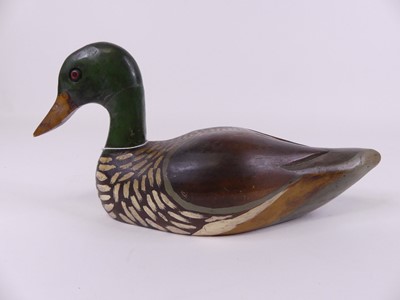 Lot 18 - A carved wooden polychrome painted decoy in...