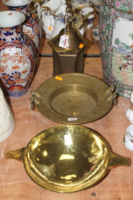 Lot 90 - A brass offerings bowl, having twin handles...