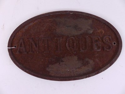 Lot 26 - A cast iron sign of oval shape, titled...
