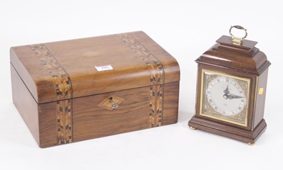 Lot 106 - A walnut cased mantel clock in the 18th...