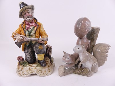 Lot 48 - A Capo di Monte figure of a man kneeling...