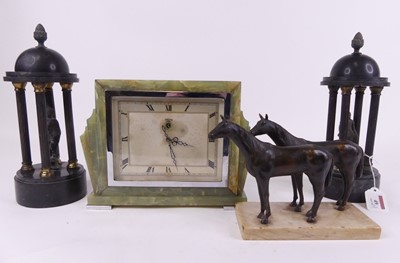 Lot 49 - A bronzed figure group of two horses standing...