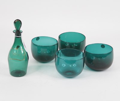 Lot 117 - A 19th century hand-blown green glass decanter...