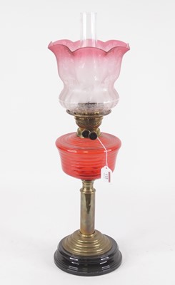 Lot 122 - An early 20th century oil lamp, having an...
