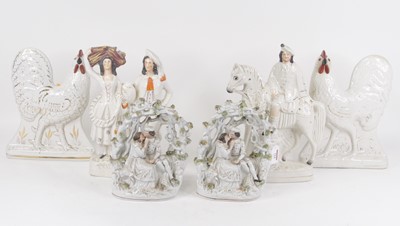 Lot 124 - A pair of Victorian Staffordshire figures,...