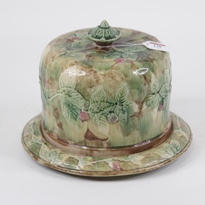 Lot 128 - A Victorian majolica glazed cheese dome and...