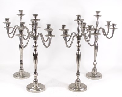 Lot 134 - A set of four chrome plated five-sconce table...