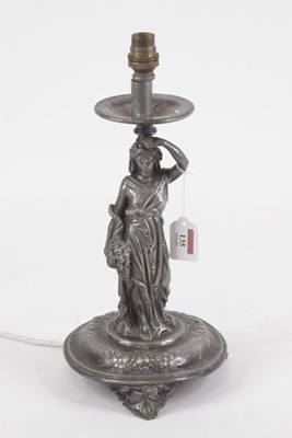 Lot 135 - An Art Nouveau figural table candlestick, the...