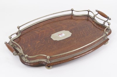 Lot 151 - A 1920s oak twin handled serving tray of...