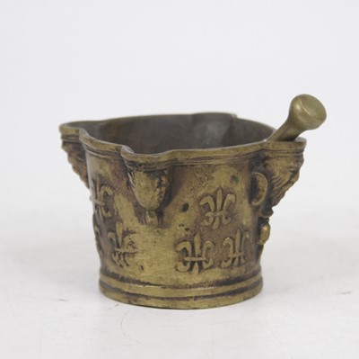 Lot 179 - A bronze pestle and mortar, the mortar having...