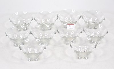 Lot 211 - A set of ten French clear glass bowls, each of...