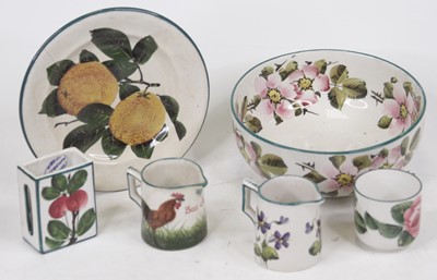 Lot 212 - A Wemyss ware cream jug, painted with...