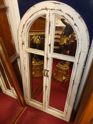 Lot 1111 - A contemporary painted arched wall mirror,...