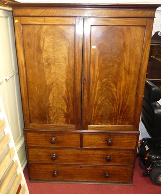 Lot 1120 - A circa 1830 mahogany linenpress, the upper...