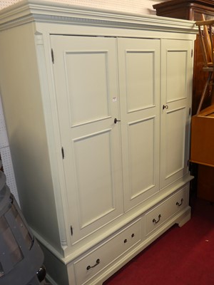 Lot 1126 - A contemporary painted pine three door...