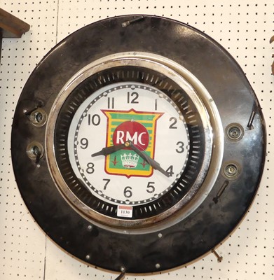 Lot 1130 - A painted metal electrical circular wall clock