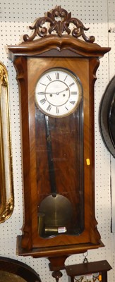 Lot 1134 - A circa 1900 figured walnut Vienna regulator...