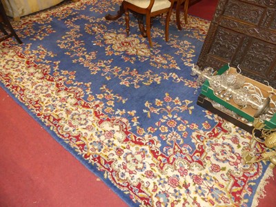 Lot 1142 - A Persian woollen blue ground Tabriz rug, with...