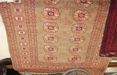 Lot 1146 - A Persian woollen pale ground Bokhara rug, 145...